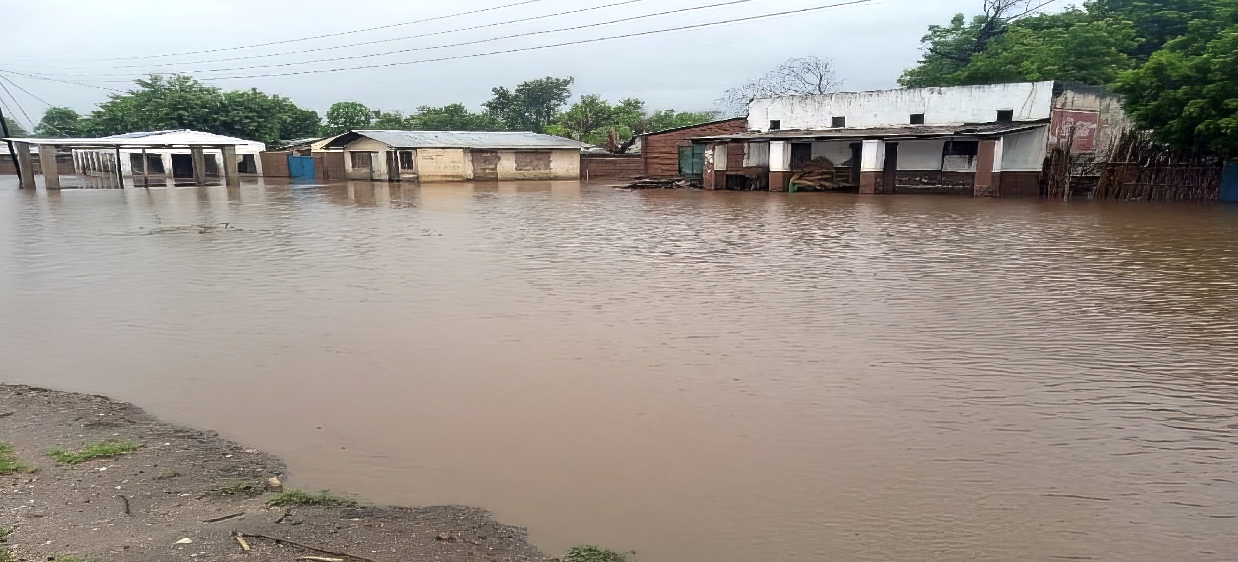 An entire street has been turned into a river, and the houses flooded.