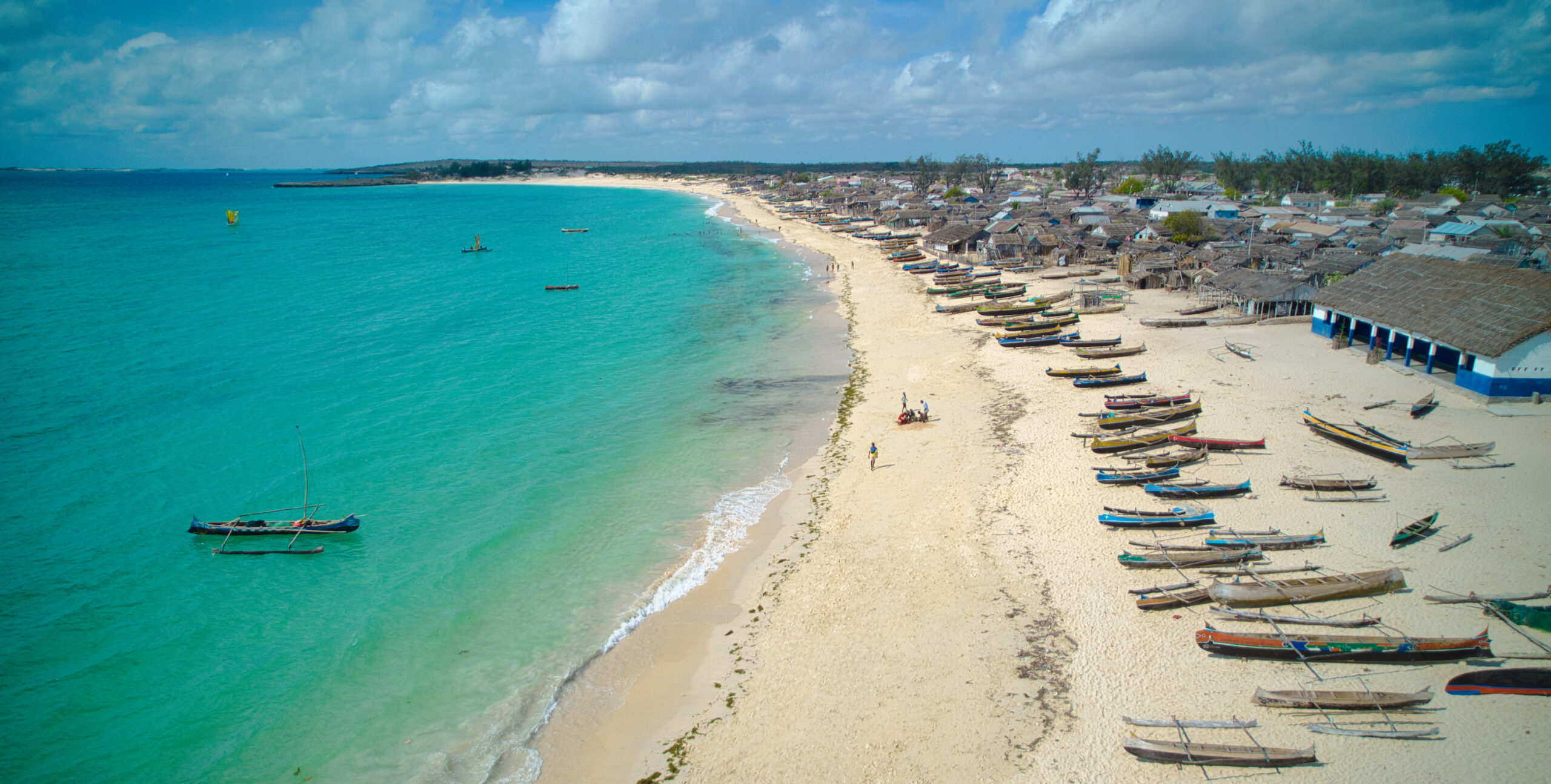 Madagascar beach with many fishing canoes.