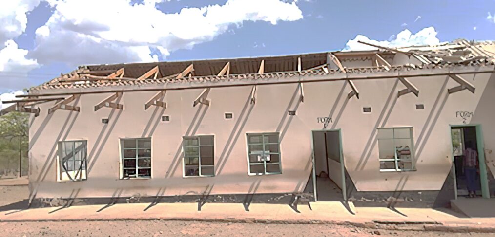 School building with badly damaged roof.