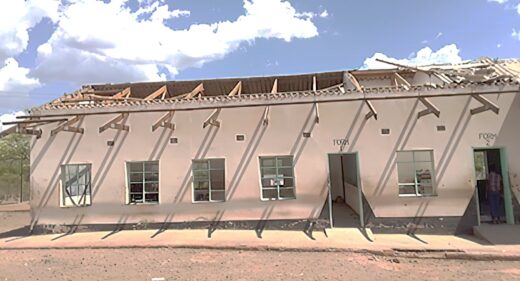 School building with badly damaged roof.